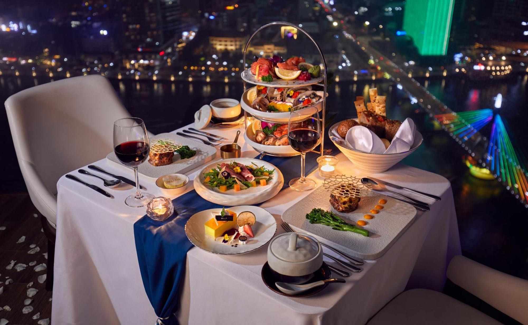 Melia Vinpearl Danang Riverfront Exterior photo A typical high tea at the 360° Bar